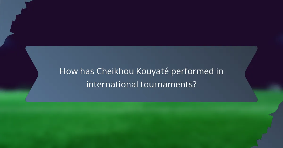 How has Cheikhou Kouyaté performed in international tournaments?
